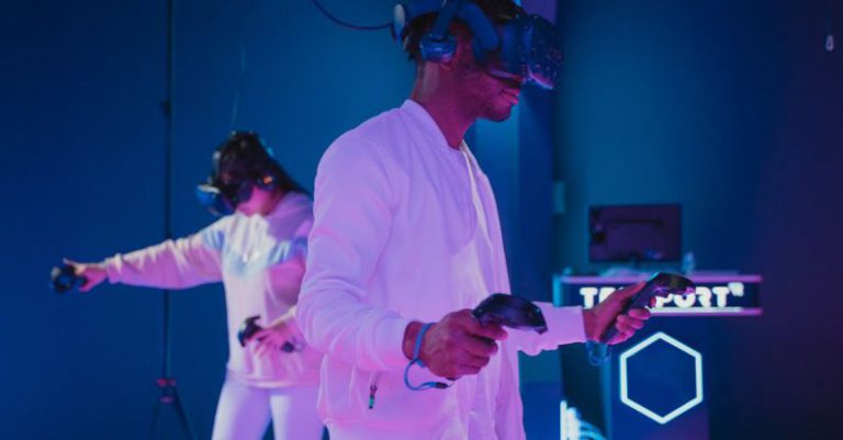 Entertainment Innovation - Man Playing a Video Game while Wearing a VR Headset