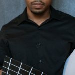 Actor Entrepreneur - Man in Black Dress Shirt Holding Blue and White Checked Textile