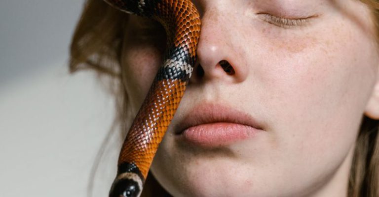 Overcoming Adversity - Close-Up Photo of a Woman Overcoming Her Fear of Snakes