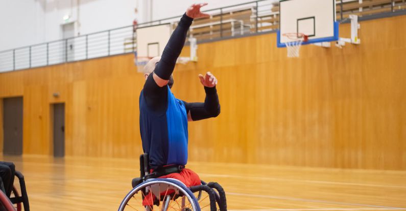 Success Despite Disability - Man on a Wheelchair Playing Basketball