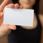 Career Promotion - Crop woman showing blank business card