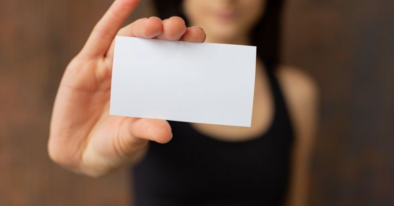 Career Promotion - Crop woman showing blank business card