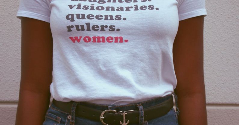 Women Empowerment - Woman Wearing White T-shirt and Blue Denim Bottoms