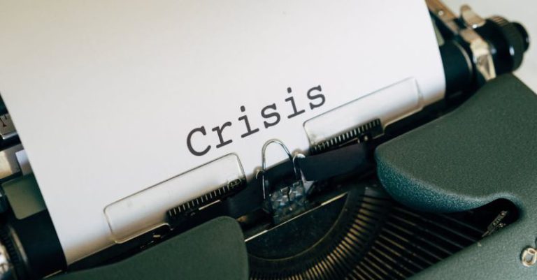 Crisis Management - White Paper On A Vintage Typewriter
