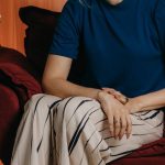 Business Diversification - A woman sitting in a chair with a flower arrangement