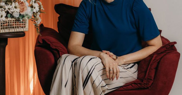 Business Diversification - A woman sitting in a chair with a flower arrangement