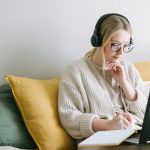 Workplace Concentration - Photo of Woman Taking Notes
