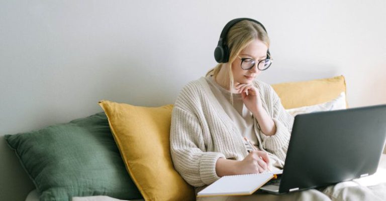 Workplace Concentration - Photo of Woman Taking Notes