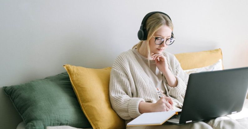 Workplace Concentration - Photo of Woman Taking Notes