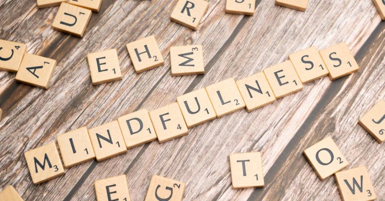 Mindful Living - The word mindfulness spelled out with scrabble tiles