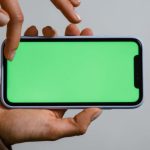 Green Innovation - Person Holding Blue and White Smartphone