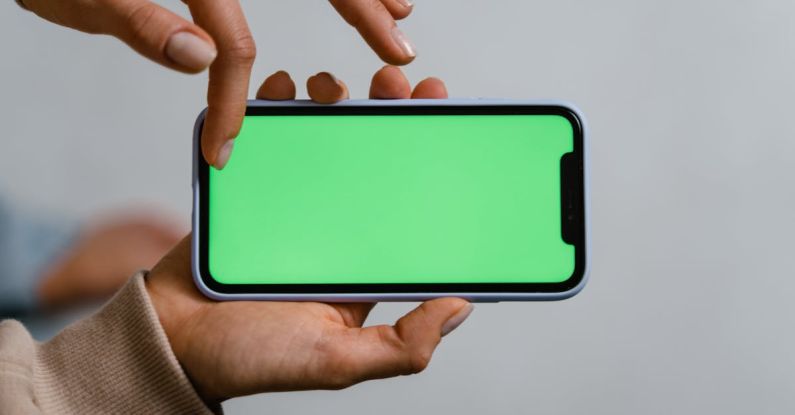 Green Innovation - Person Holding Blue and White Smartphone